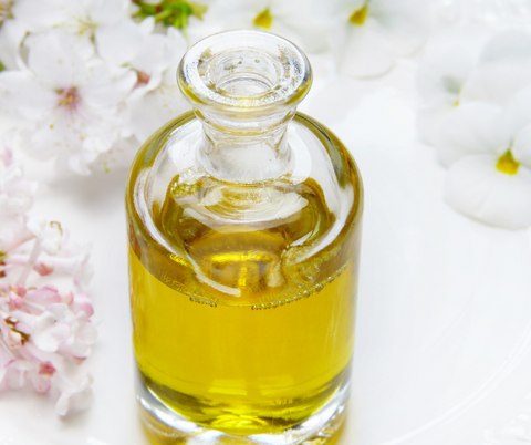 glass bottle with golden oil