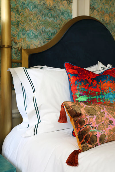 Velvet luxury cushions on a bed