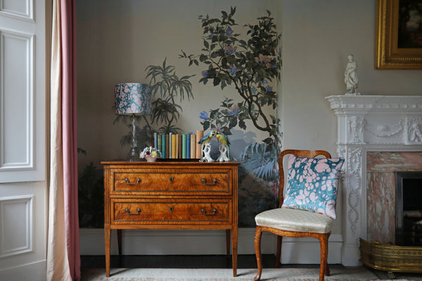 Velvet cushion on chair in bedroom paired with matching lampshade