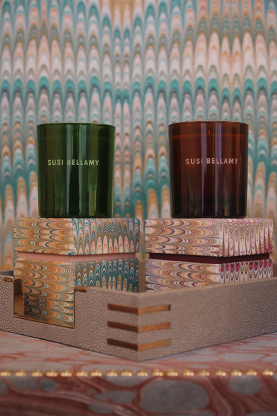 luxury candles sat on top of their handmade boxes
