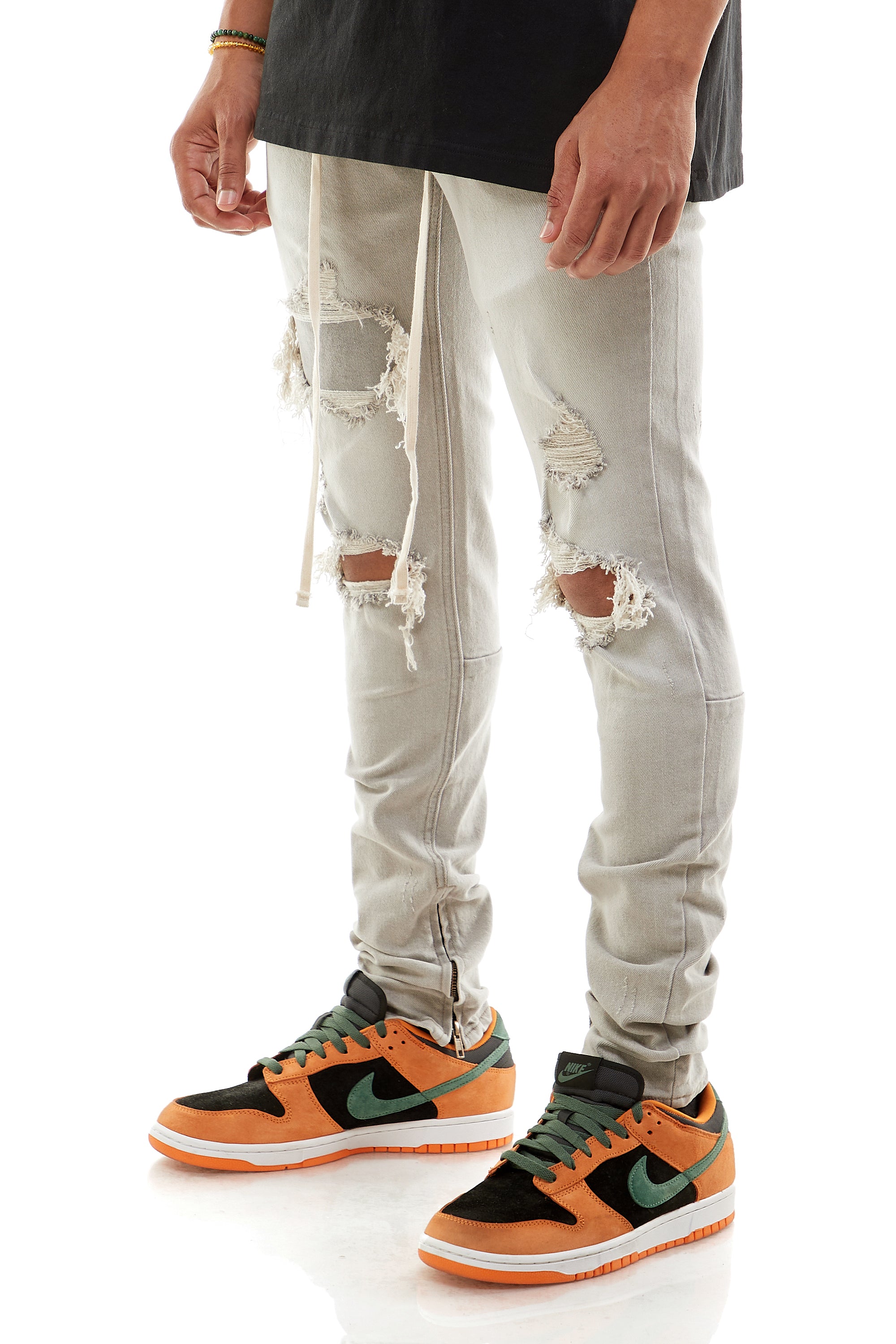 UNDER-PATCH ANKLE ZIP JEANS