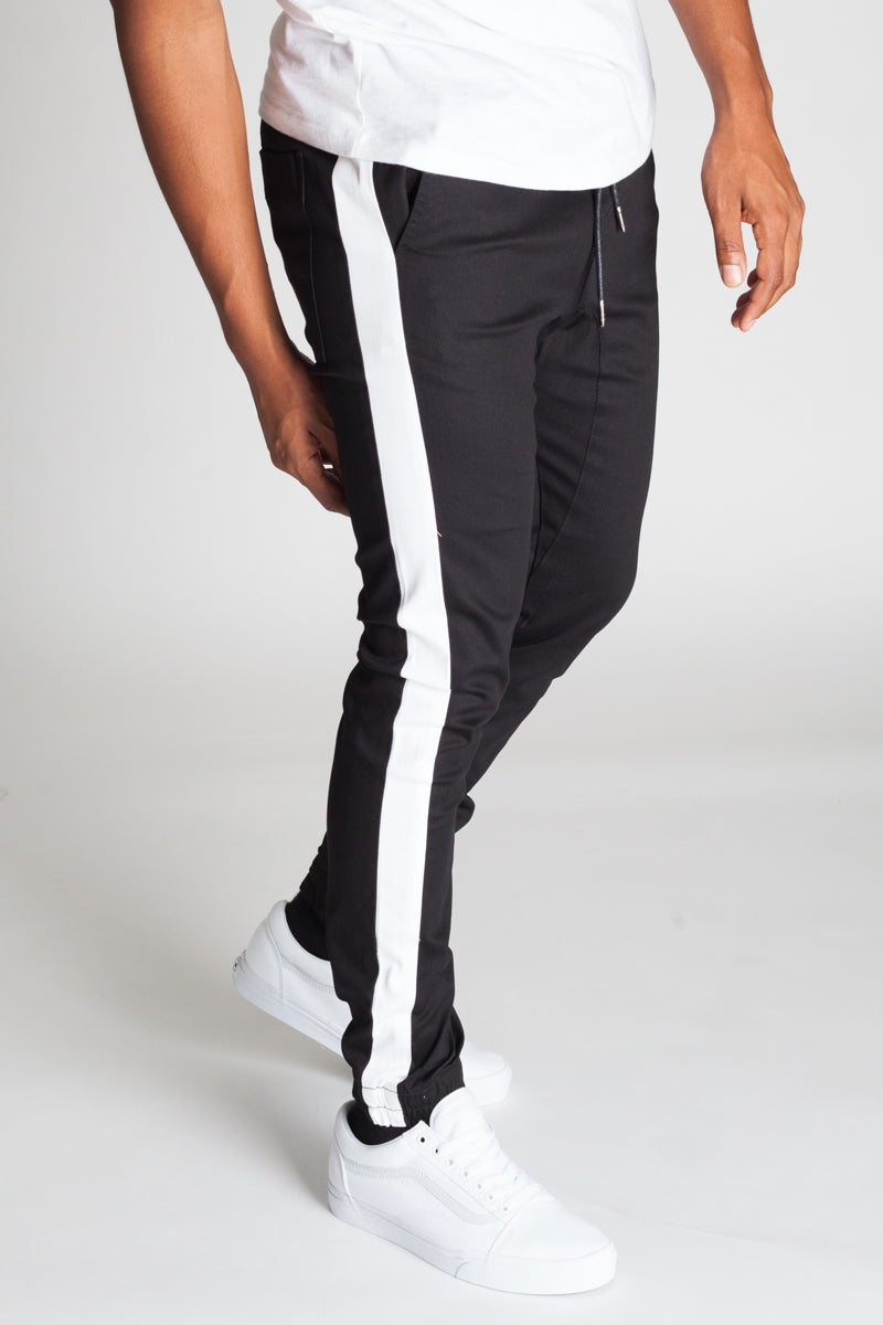 white joggers black stripe