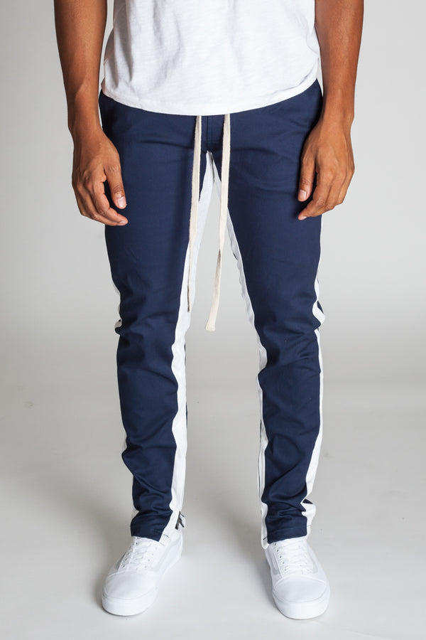 blue track pants with white stripe