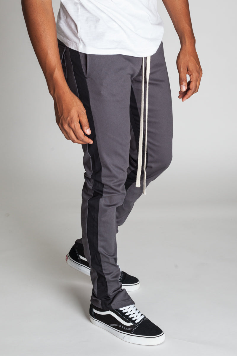 STRIPED TRACK PANTS WITH ANKLED ZIPPERS