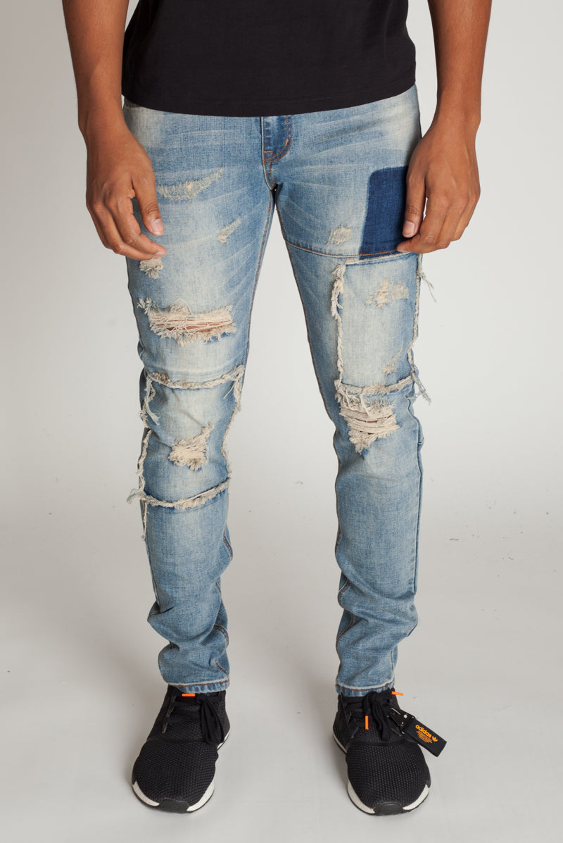 distressed patched jeans