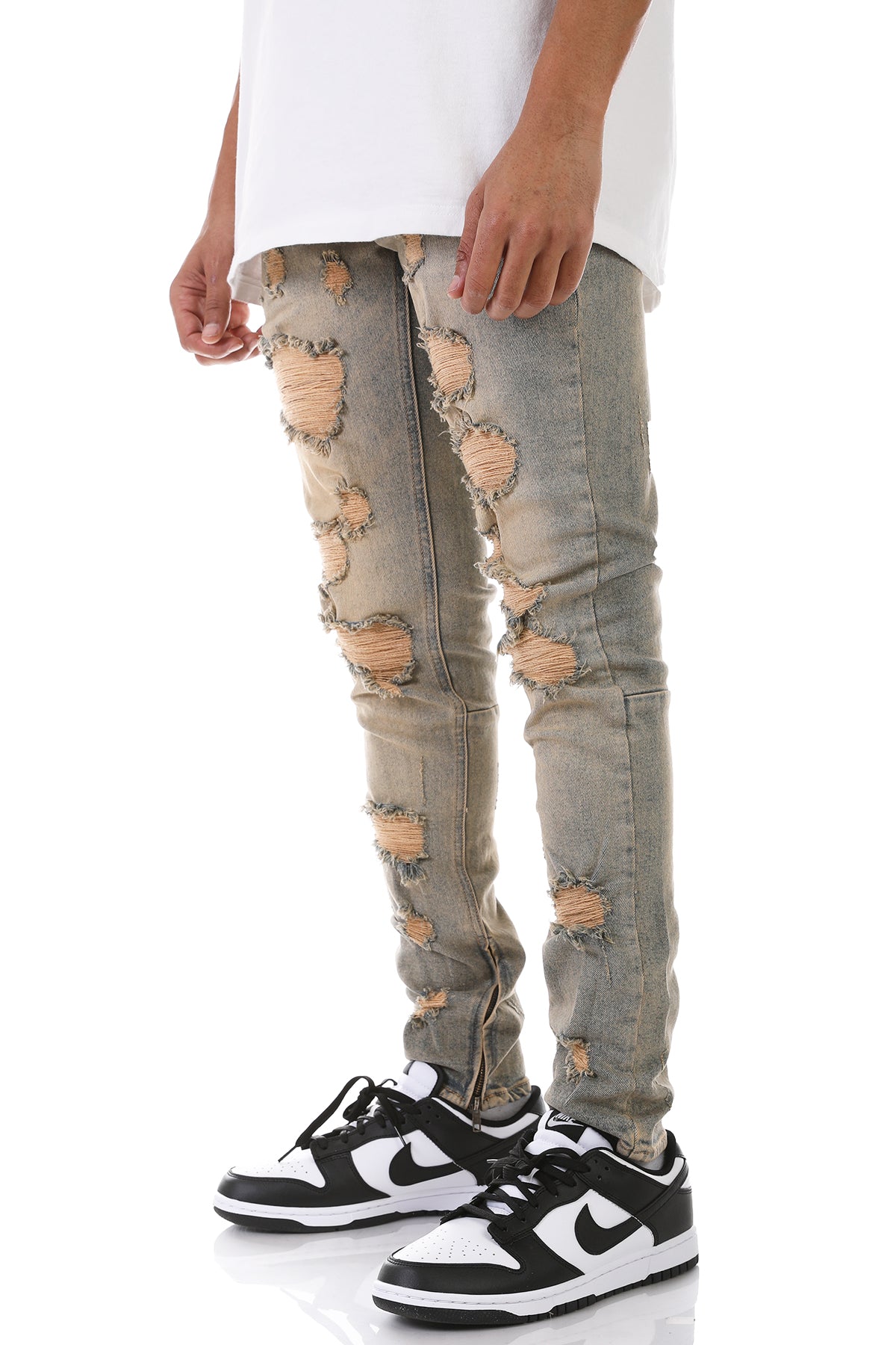 MULTI-DISTRESSED JEANS WITH ANKLED ZIPPERS