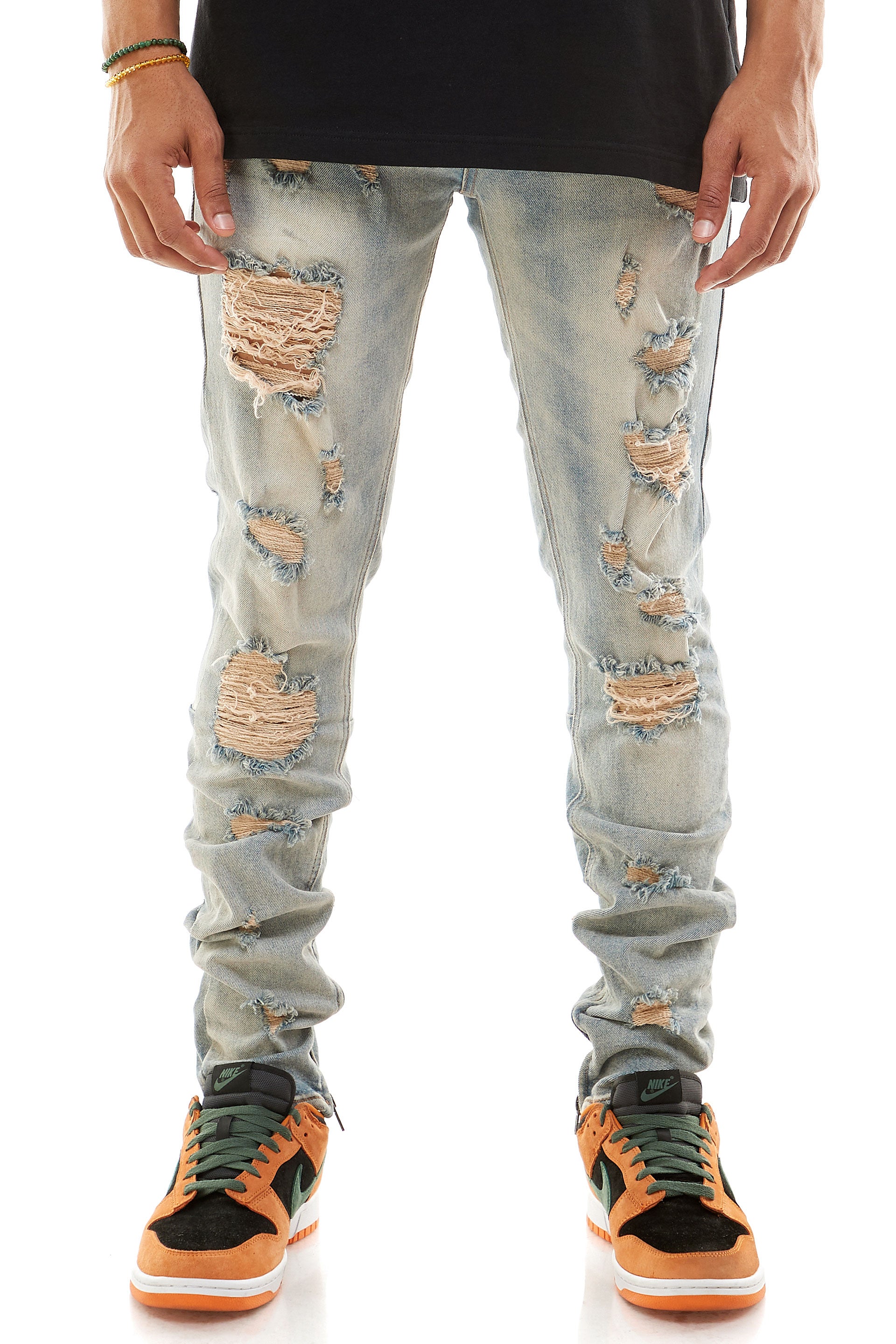 MULTI-DISTRESSED JEANS WITH ANKLED ZIPPERS