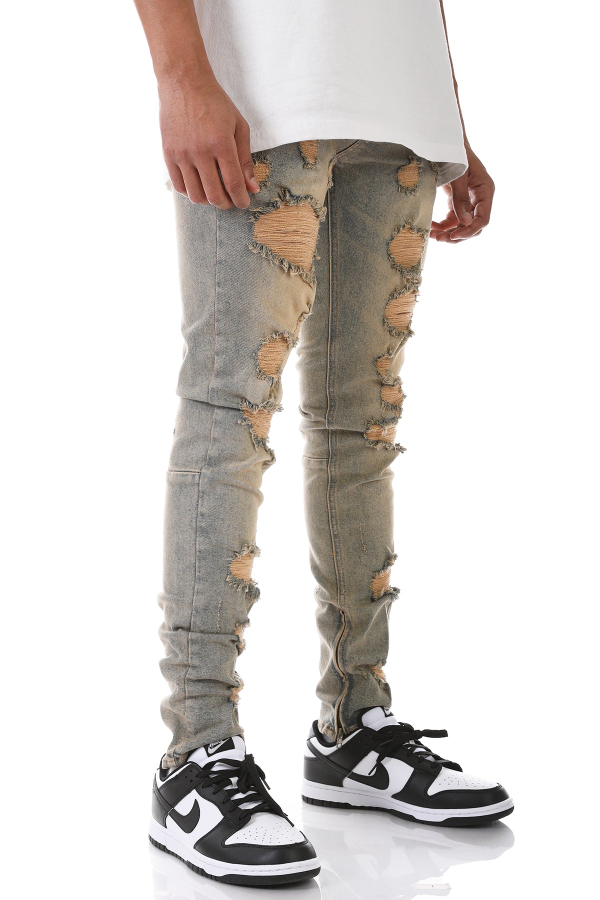 MULTI-DISTRESSED JEANS WITH ANKLED ZIPPERS