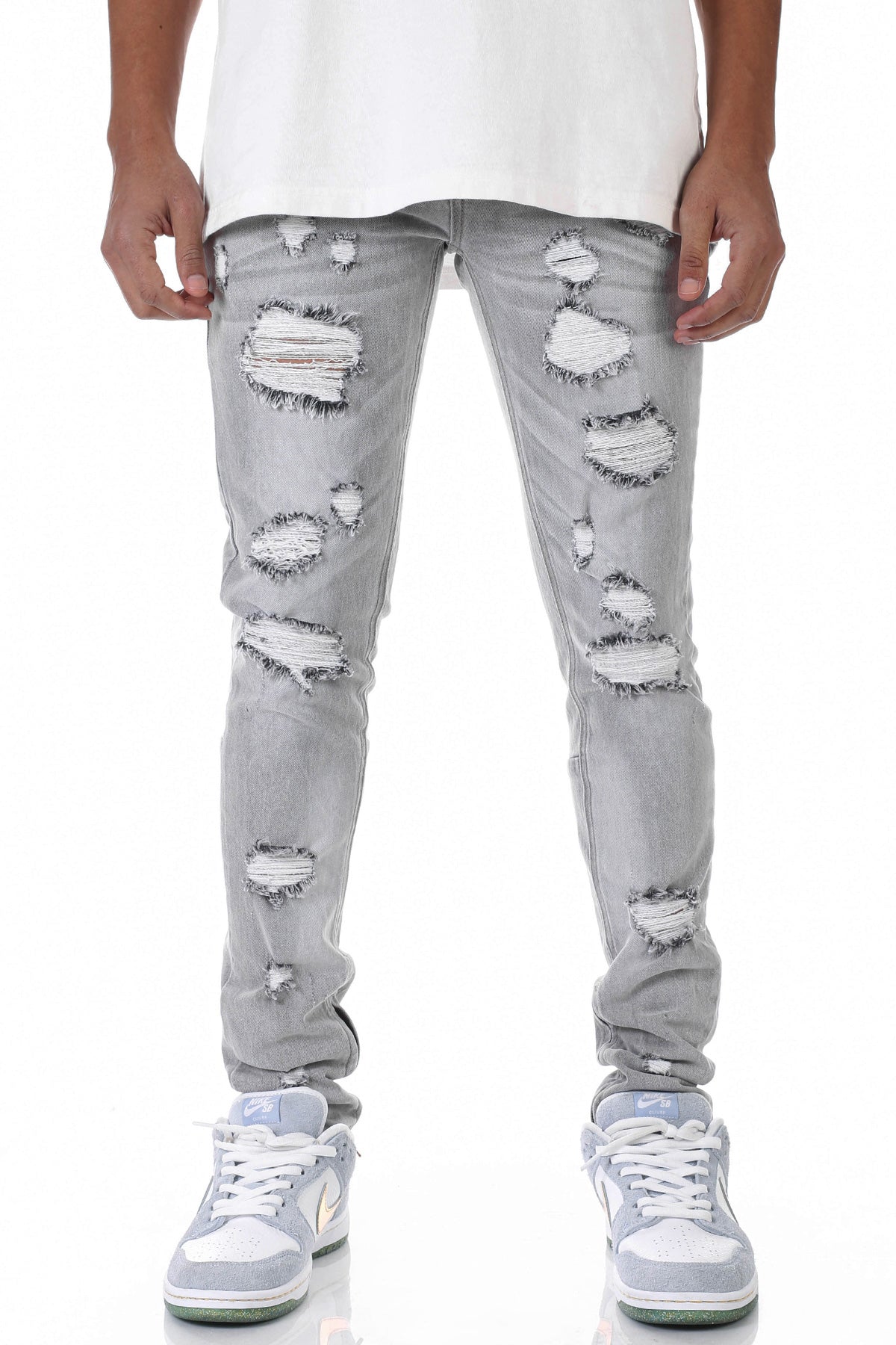 MULTI-DISTRESSED JEANS WITH ANKLED ZIPPERS