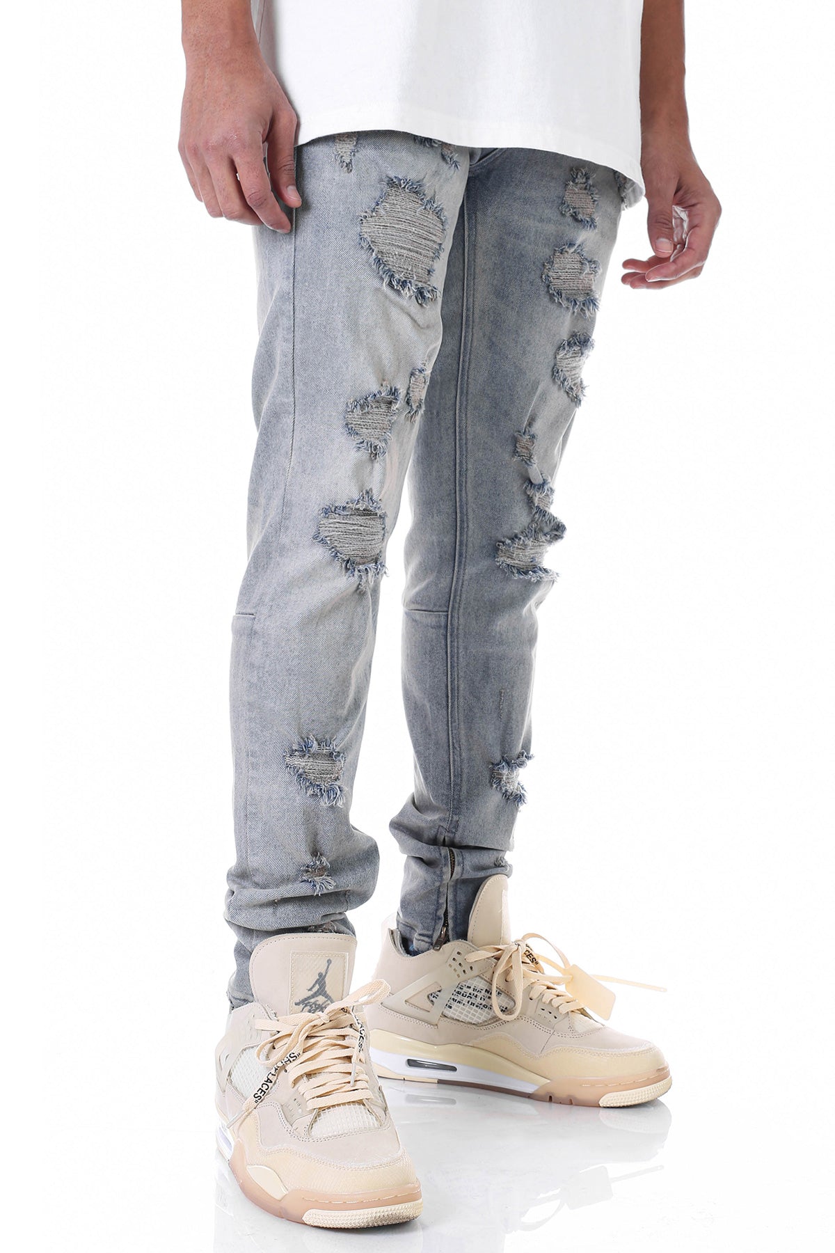 MULTI-DISTRESSED JEANS WITH ANKLED ZIPPERS