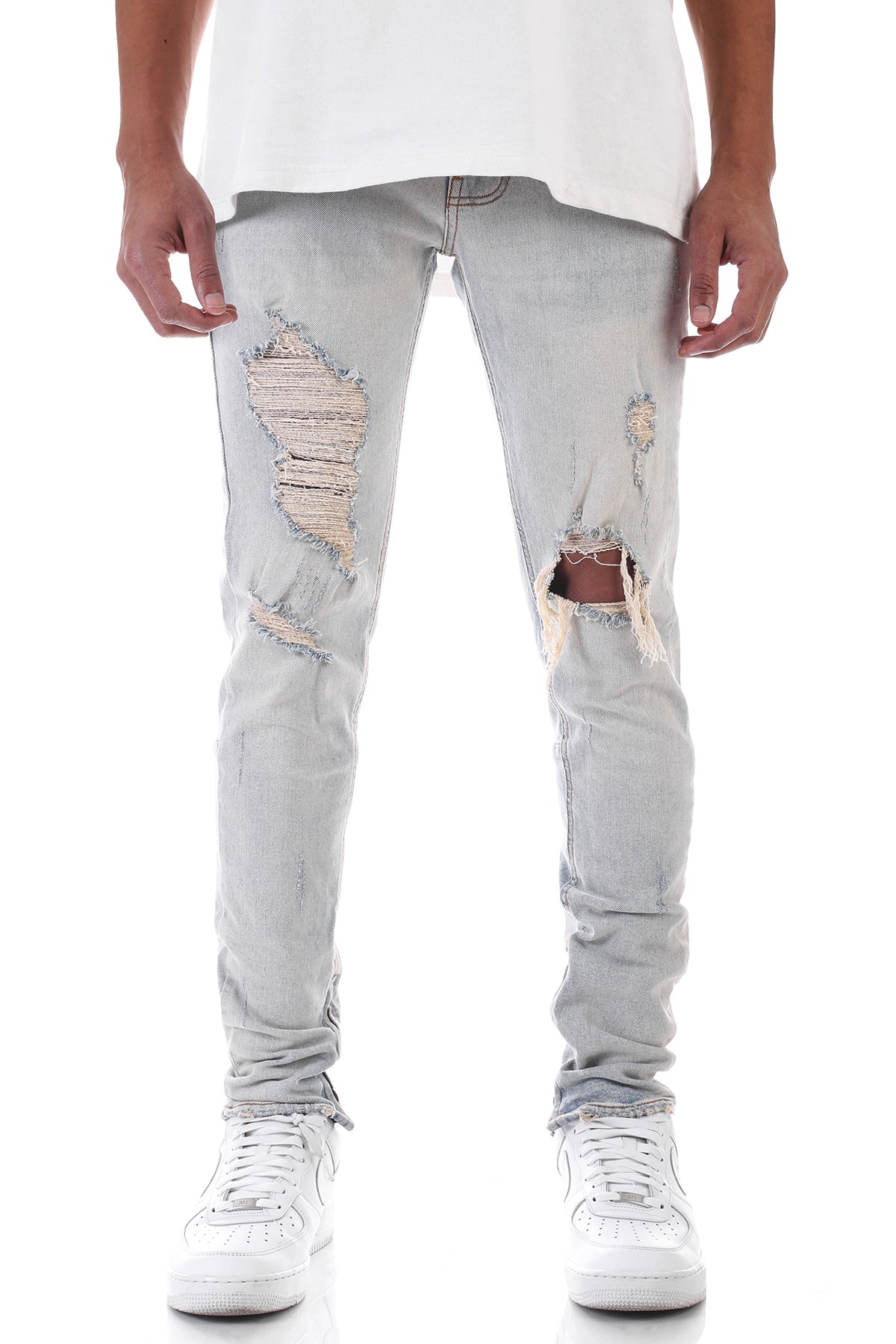 DISTRESSED ANKLE ZIP JEANS