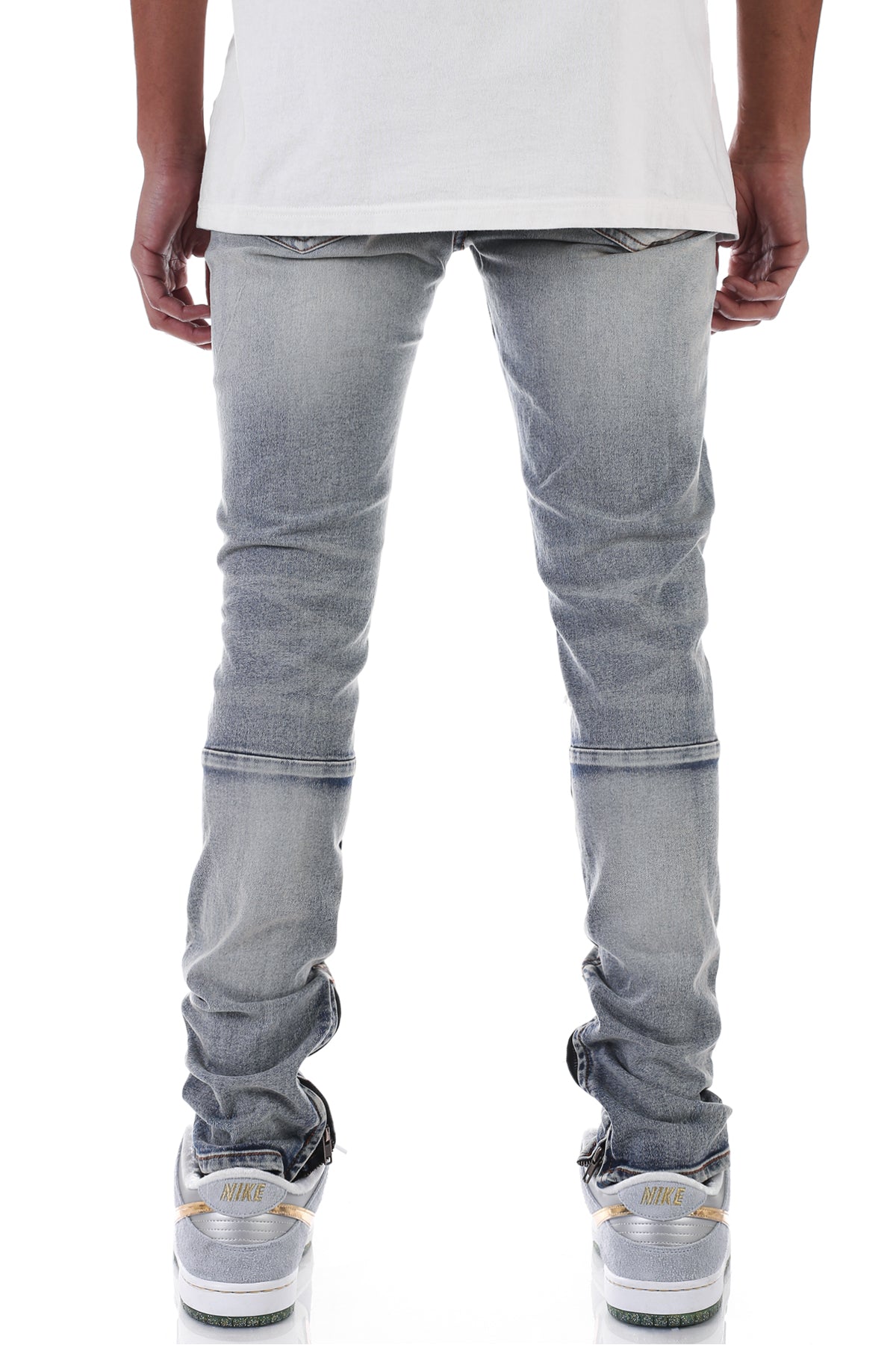 DISTRESSED ANKLE ZIP JEANS