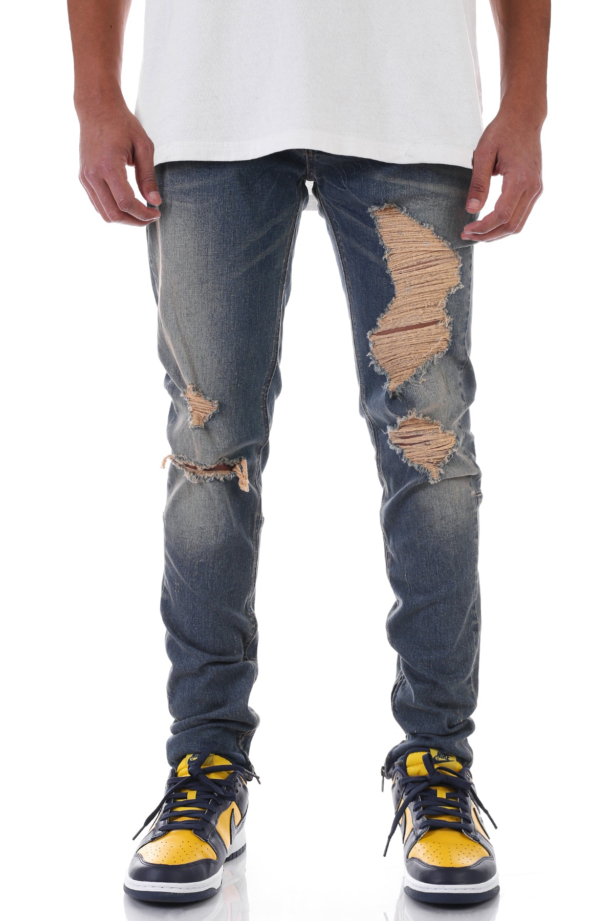 DISTRESSED ANKLE ZIP JEANS