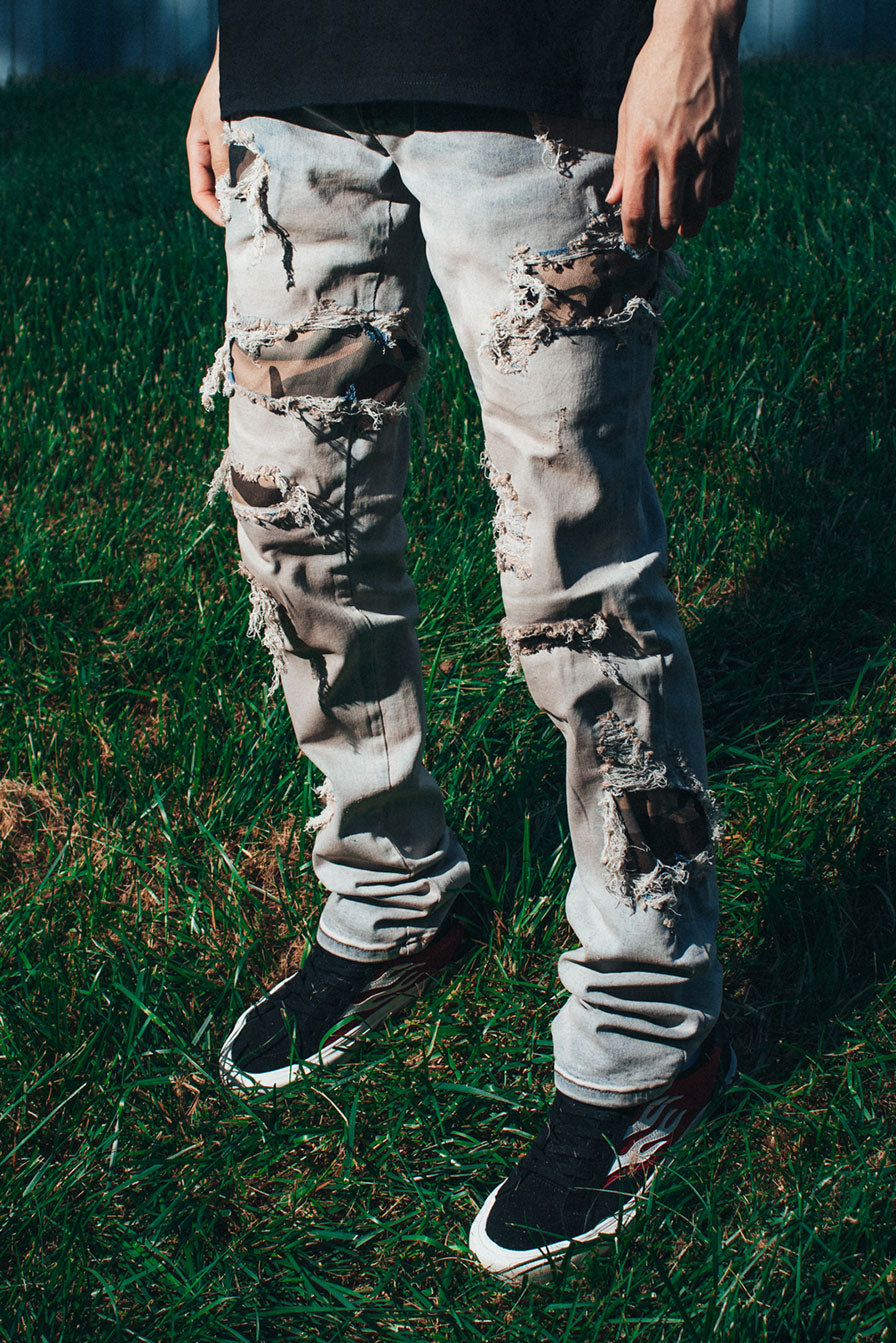 STACKED CAMO PATCH JEANS