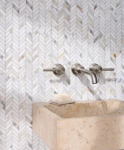 Bathroom with herringbone mosaic backsplash