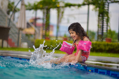 Child playing in pool