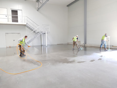 Workers cleaning a floor