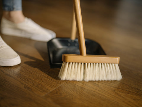 Push broom on wood-look tile floor