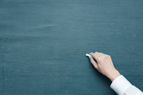 Hand holding chalk