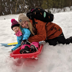 mum with girl on snow holiday