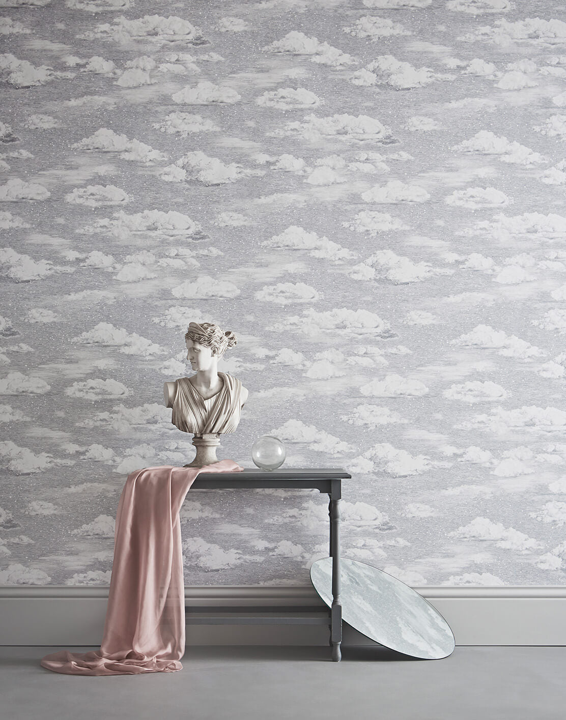 Grey sky clouds wallpaper behind table