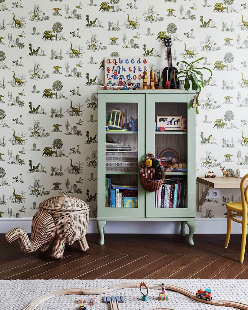 Green vintage style cabinet and dinosaur nursery wallpaper by Sian Zeng