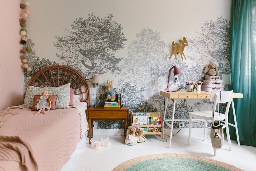 Little girl’s bedroom with dusty pinks and grey trees wallpaper