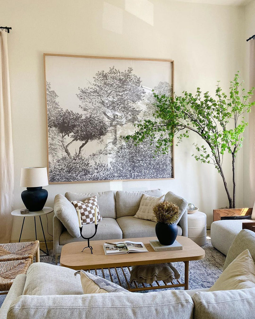 Grey trees wallpaper framed in modern living room