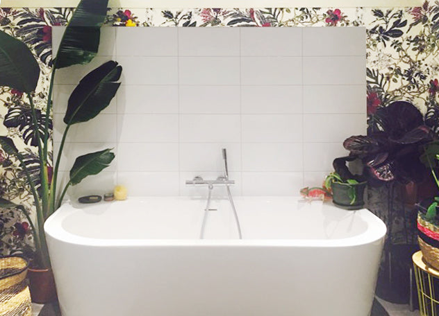 modern white tiles and plants in the bathroom with Tropical Bloom wallpaper by Sian Zeng