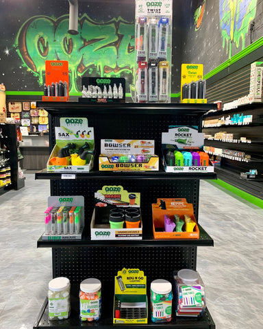 A display shelf of all Ooze products, including silicone and batteries, in the Ooze Wholesale showroom