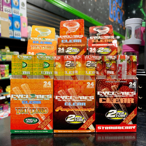 Three counter displays of Cyclones Clear Cones sit together on a black shelf.