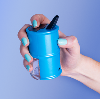 A hand holding a blue Ooze Electro Barrel E-rig