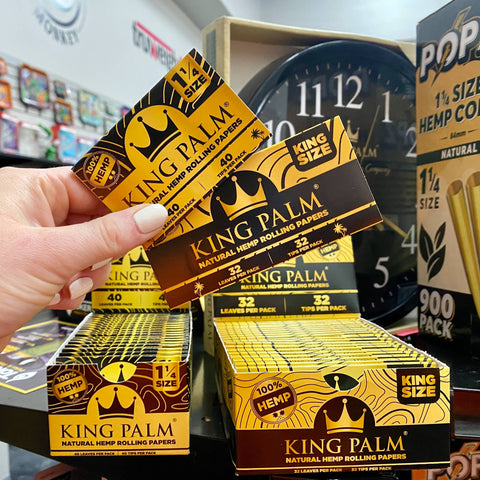 King Palm hemp rolling papers are held up above their displays in the Cannatron wholesale showroom.