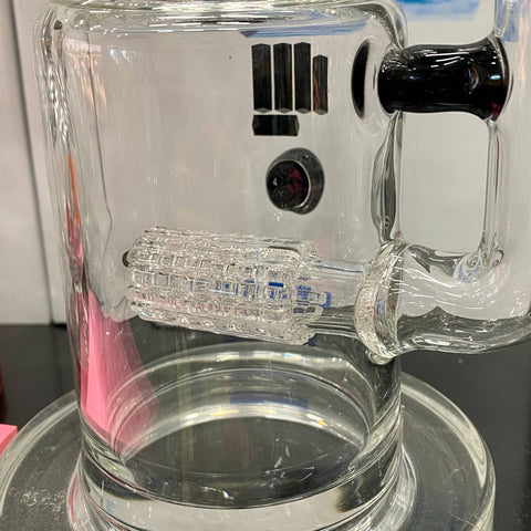 A close-up shot of a percolator in a glass bong.