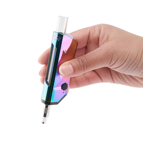 A white hand holds the Ooze Pronto electric nectar collector against a white background.