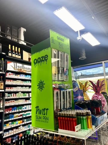 A 48ct display of Ooze Twist Slim Pen 2.0s in a gas station