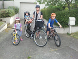 Billie Sue with kids biking to school