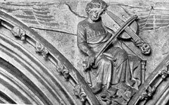 Carving of an angel playing a vielle in Lincoln cathedral