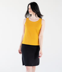 woman wearing a yellow tank top and black a-line skirt made of bamboo