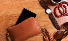 leather wallet and accessories flatlay