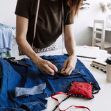woman upcycling a pair of jeans