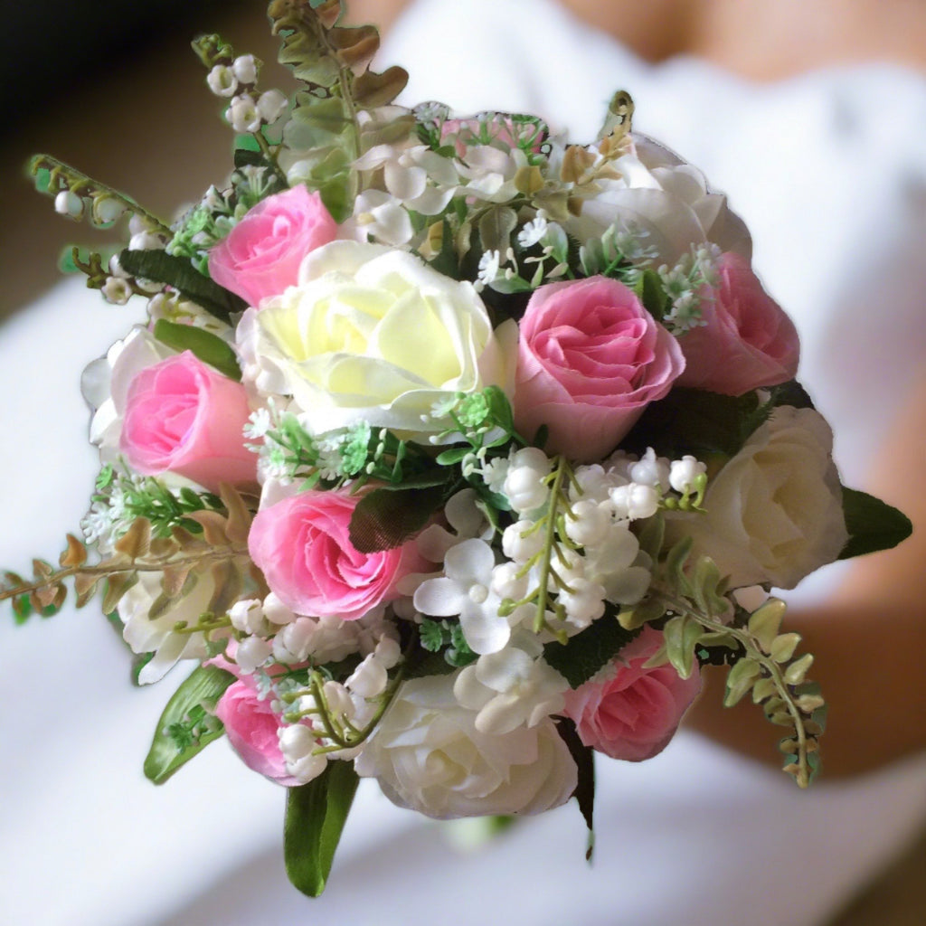 - A wedding bouquet featuring silk ivory and pink roses & foliage ...