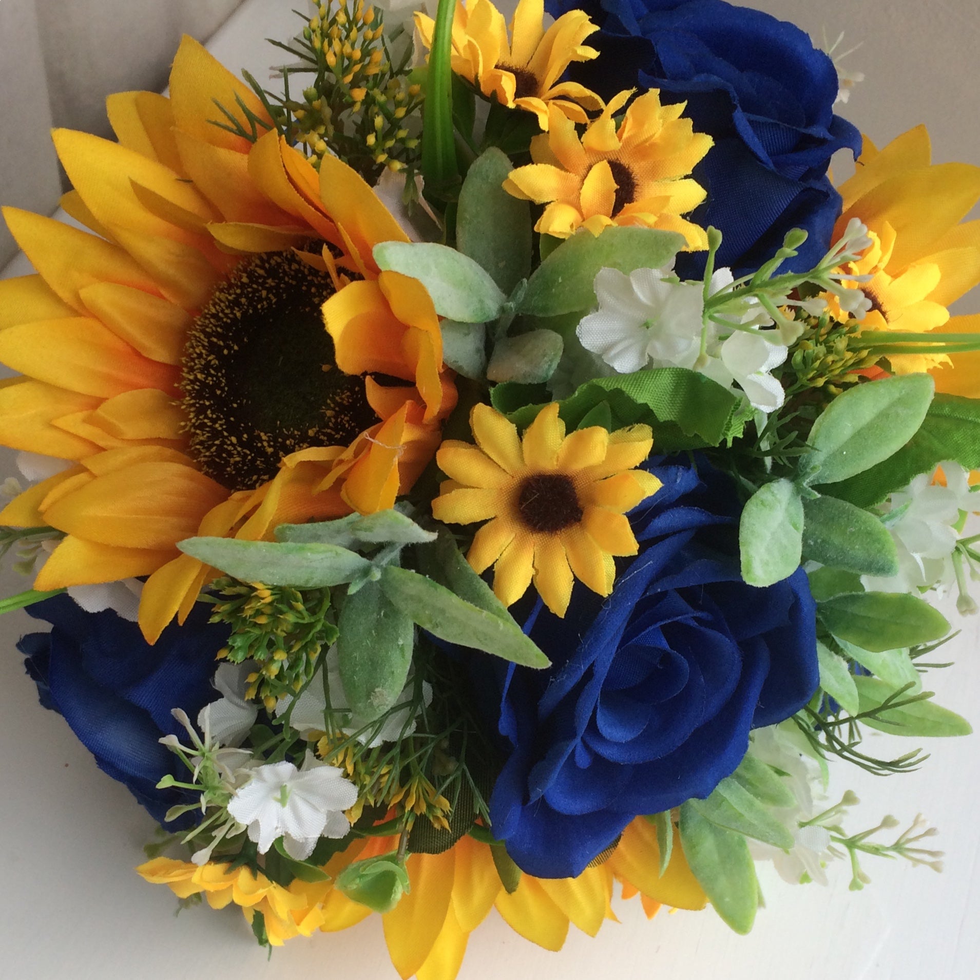 A Collection Of Wedding Bouquets Featuring Sunflowers And Royal Blue