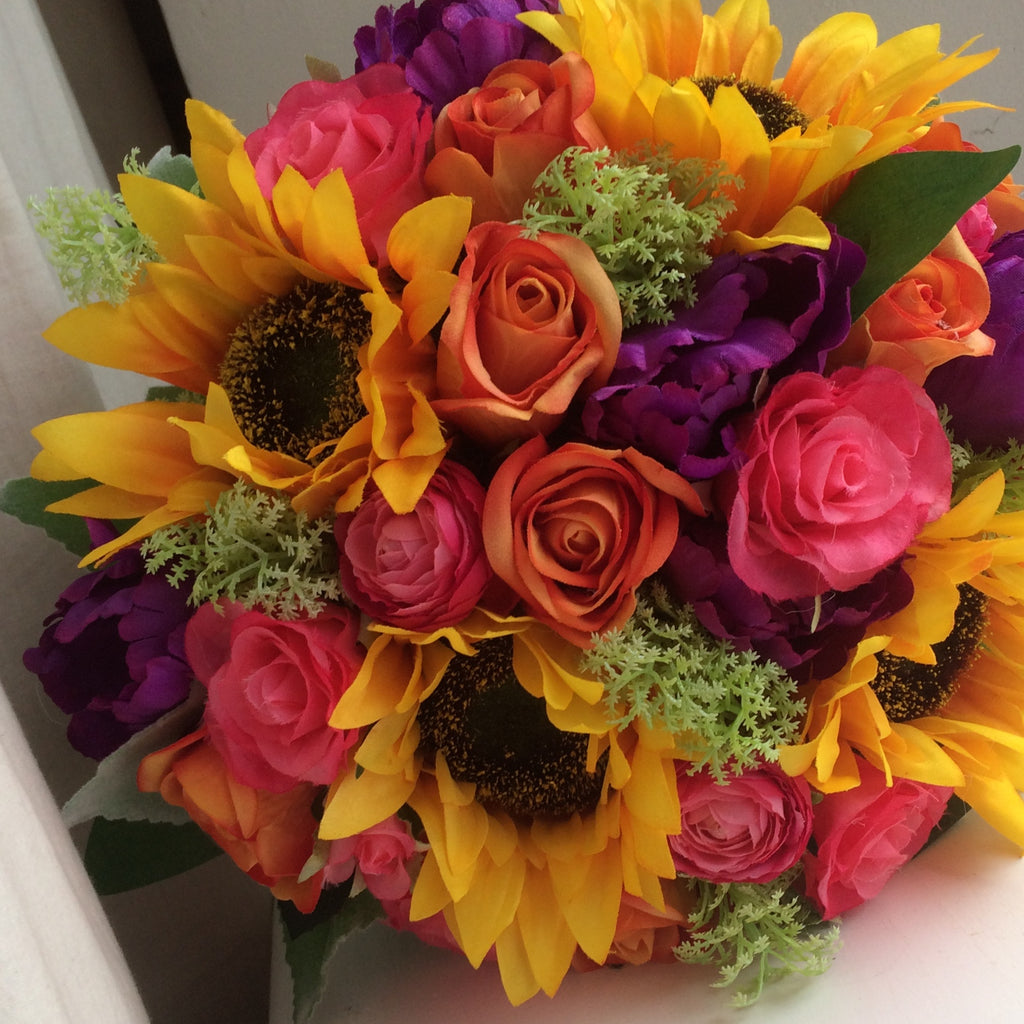 - a brides bouquet of sunflowers roses, ranunculus and tulips – AbigailRose