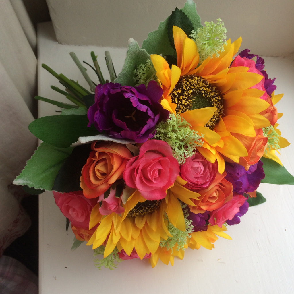 - a brides bouquet of sunflowers roses, ranunculus and tulips – AbigailRose