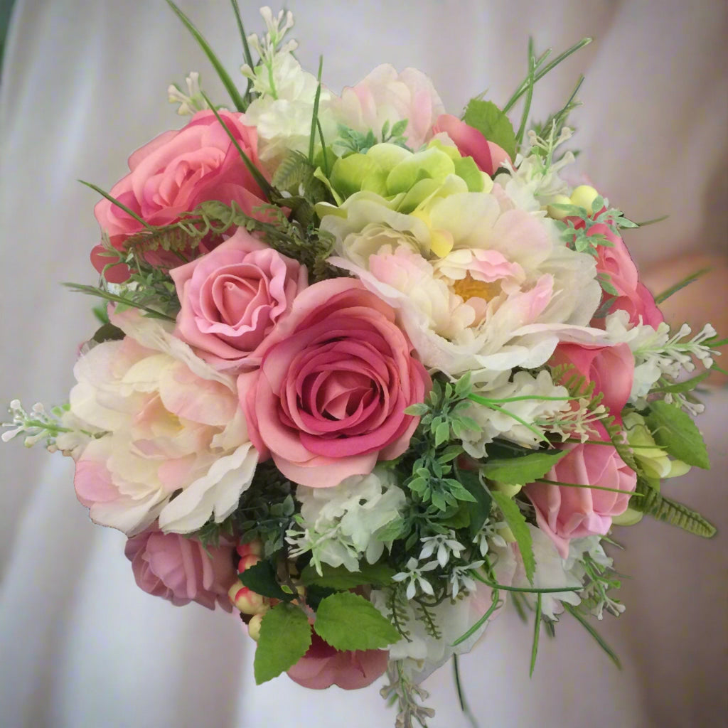 A bridal bouquet of artificial silk pink silk rose peony and berries ...