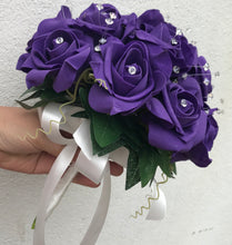 - a wedding bouquet of artificial purple foam roses with diamante centres