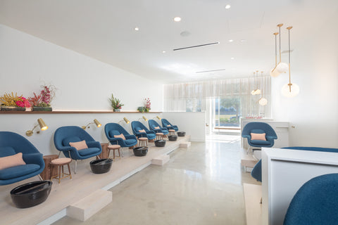 Nail salon pictured with royal blue chairs and pink pillows- Non-Toxic hand and foot care