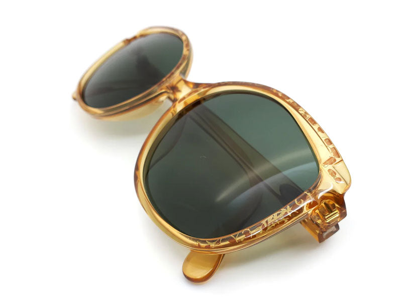 Gold frame glasses with bottle green lens