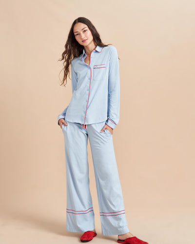 Pajama party ready. Our PJs are cut from our super soft t-shirt fabric for the ultimate in comfort and style when you need a little hygge. Pale blue cotton framed with contrasting red piping, our PJ set has a relaxed-fit top and elasticated drawstring wide-leg pants.